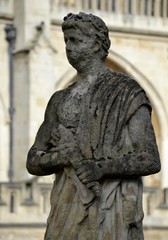 Naklejka premium Old statues from Bath and background 