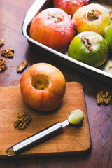 Apples with stuffed with walnuts and sugar, ready to be baked