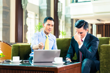 Asian Businessmen having meeting