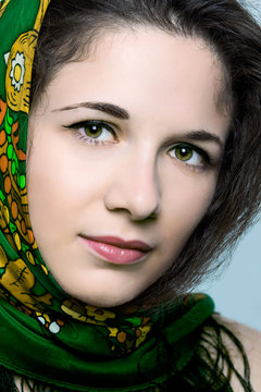 Portrait of young and beautiful  woman wearing scarf