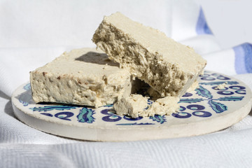 Pieces of halva on the traditional ceramic plate