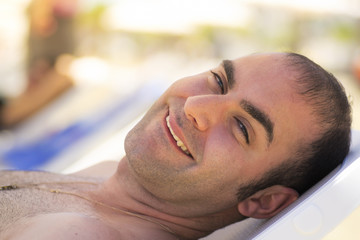Relaxing on a sunbed