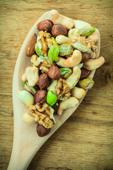 Varieties of nuts: cashew, pistachio, almond.