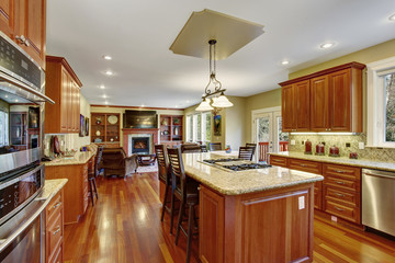 Classic kitchen with hardwood floor, china, and marble counters.
