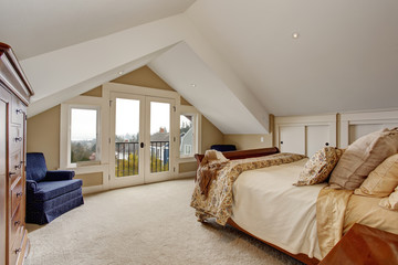 refined master bedroom with carpet and balcony.