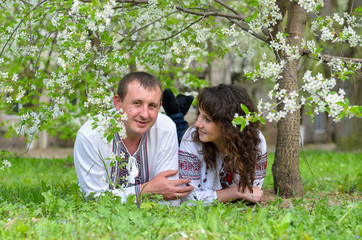 a man and woman go for a walk on nature in spring love