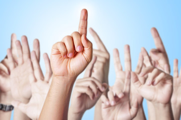 Hands raised together