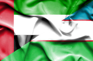 Waving flag of Uzbekistan and United Arab Emirates