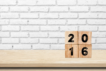 Wooden cubes with 2016 on wooden table background