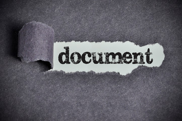 document word under torn black sugar paper