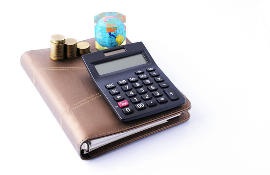 Business concept with calculator and money coins stack on busine