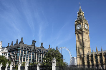 Fototapeta na wymiar Big Ben London clock tower houses of parliament with millenium wheel london eye ferris wheel in the background photo
