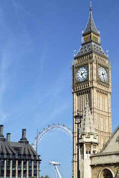 Big Ben London clock tower houses of parliament with millenium wheel london eye ferris wheel in the background photo vertical