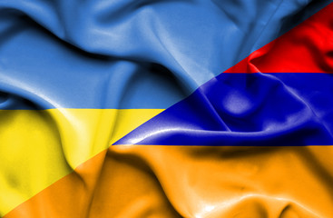 Waving flag of Armenia and Ukraine
