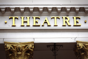 Obraz premium Theatre sign above entrance to an old theater building in London West End photo