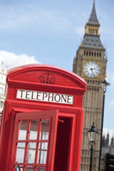 Fototapeta na wymiar London red telephone box with Big Ben clock tower in the background photo vertical
