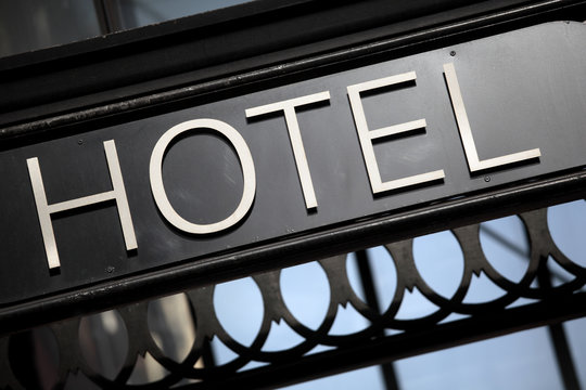 Hotel entrance sign above a small luxury hotel in London photo