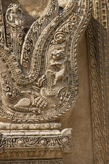 Detail of stone carving with mythical beasts decorating a temple.Bagan,Myanmar