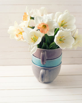 Fresh narcissus  and tulips in vase