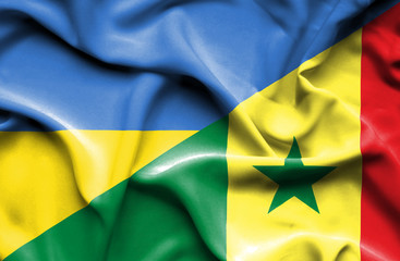 Waving flag of Senegal and Ukraine
