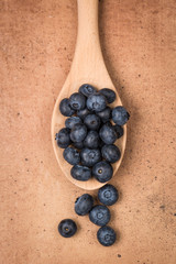 Blueberries on a wooden spoon