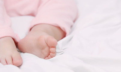 close up little foots of sleeping cute baby