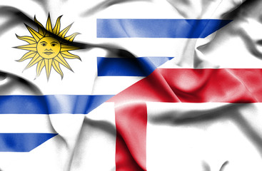 Waving flag of England and Uruguay