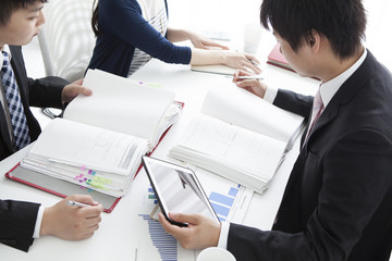 Businessman looking at a lot of documents