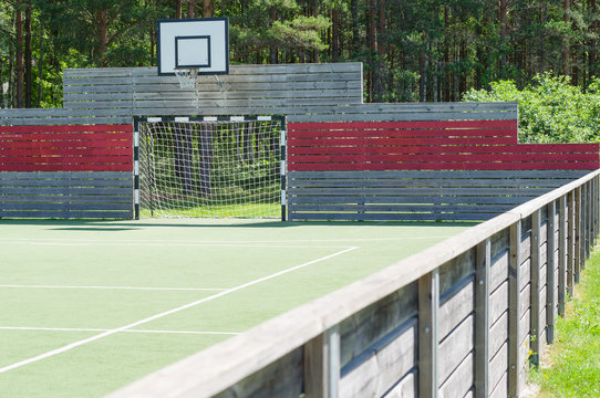 Soccer goal and basketball hoop on universal outdoor playground