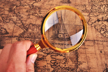 ancient map and magnifying glass