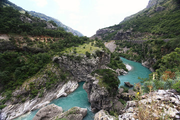 mountain landscape with mountain turbulent river in the gorge