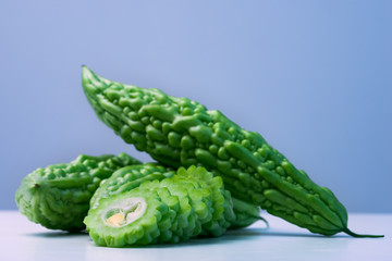 Karela bitter melon caraili studio close up blue background