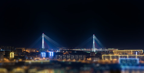 Vladivostok, bridge. Night view. Tilt-shift effect.