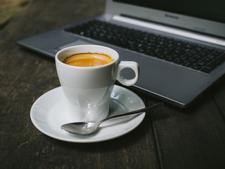 cup of coffee latte on the wood texture