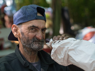 homeless man drinking