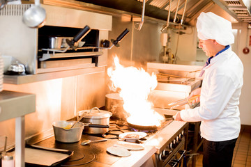 Chef with high burning flames