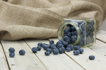 Blueberries spilt from a jar