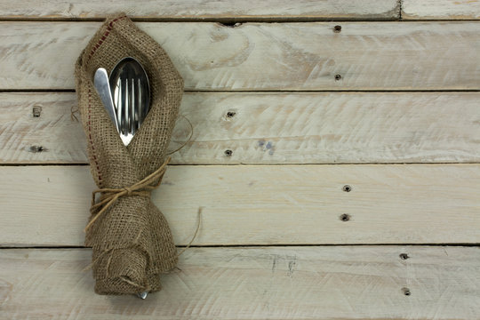 Cuttlery on a rustic wooden background