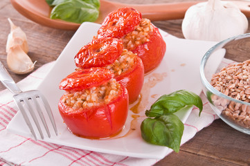 Stuffed tomatoes on a white plate. 