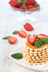Waffles and ripe strawberries.