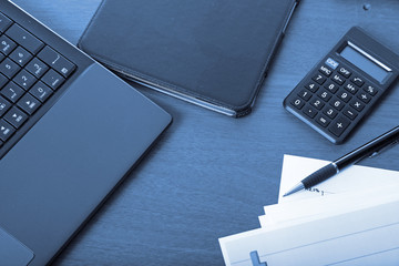 Calculator, laptop,tablet and financial documents