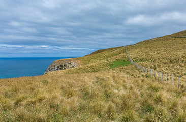 Fototapeta na wymiar Cliffs on the rough side of the peninsula