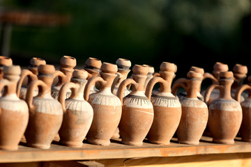 Fototapeta na wymiar clay jugs on a counter prepared for sale, Turkey