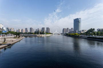 modern buildings in urban city at riverbank