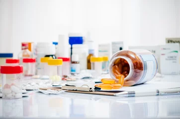 Wall murals Pharmacy medicine capsules laid out on a folder