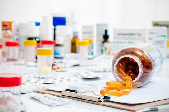 medicine capsules laid out on a folder