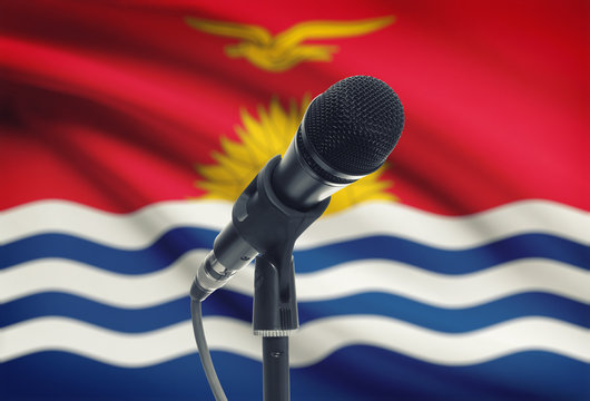 Microphone on stand with national flag on background - Kiribati