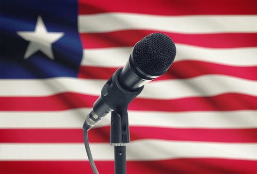 Microphone on stand with national flag on background - Liberia