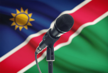 Microphone on stand with national flag on background - Namibia