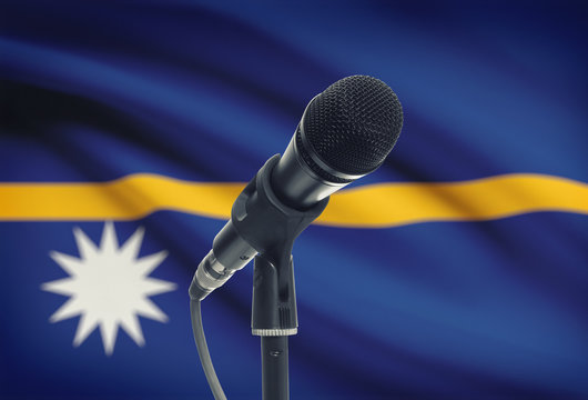 Microphone on stand with national flag on background - Nauru